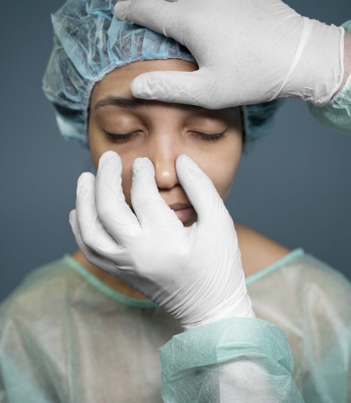 doctor-checking-patient-s-nose-before-surgery